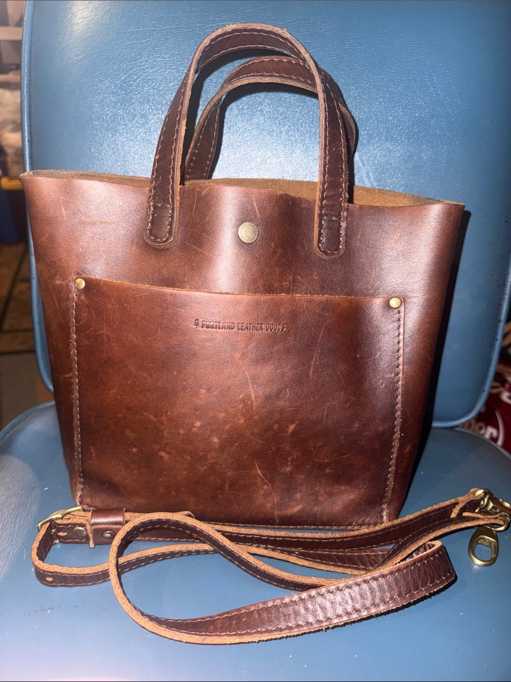 Portland Brown Leather Tote with Front Pocket and shoulder strap.